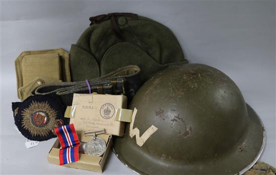 A British WW2 helmet, an army belt, a marching compass in case, a side cap,